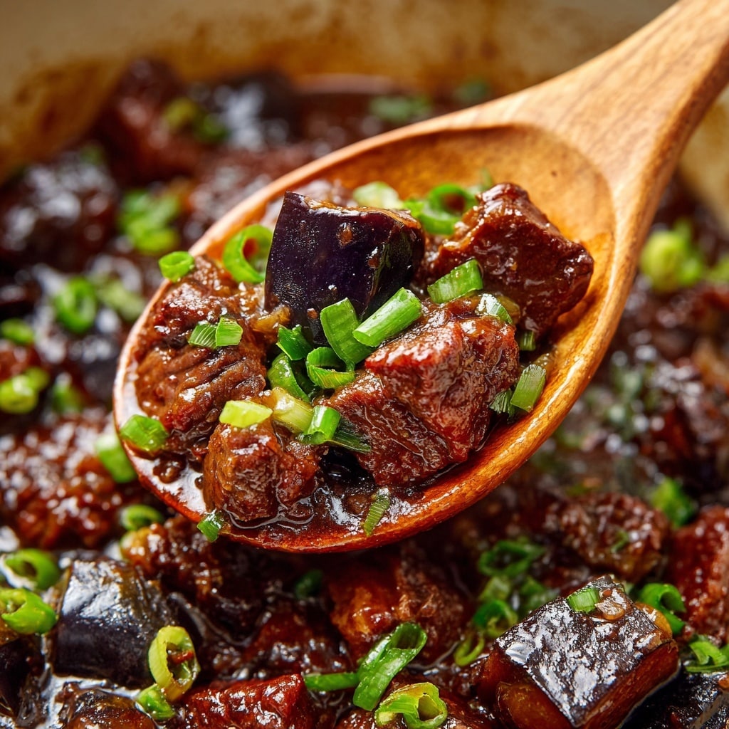 A bowl of white rice forms the bottom layer, fluffy and neatly packed. On top, there is a thick layer of dark brown beef strips covered in a shiny sauce, sprinkled with white sesame seeds and bright green chopped scallions. Two wooden chopsticks are placed resting on the beef. The bowl is held by two woman's hands against a white marbled surface with some green scallions visible in the background. photo taken with an iphone --ar 4:5 --v 7