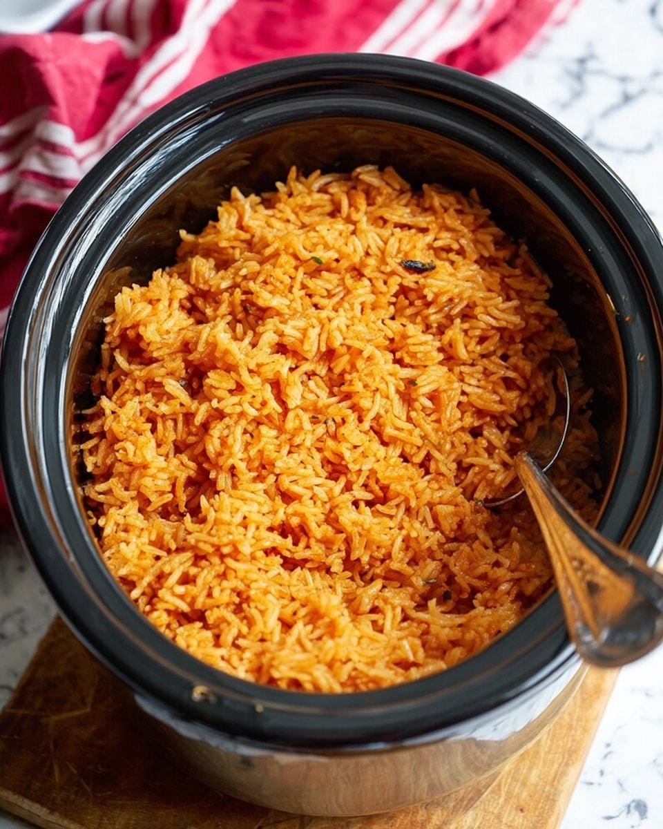A close-up of a large round brown clay pot filled with cooked seasoned rice that has an orange-brown color mixed evenly with darker brown specks, topped with scattered fresh green cilantro leaves. A silver spoon rests on the rice near the top right side. The pot has a dotted white trim around the upper edge and is set on a white marbled surface with a white and red striped cloth nearby. Part of a matching clay lid with blue and white flower designs is visible next to the pot. Photo taken with an iphone --ar 4:5 --v 7